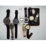 A collection of vintage and modern wristwatches.