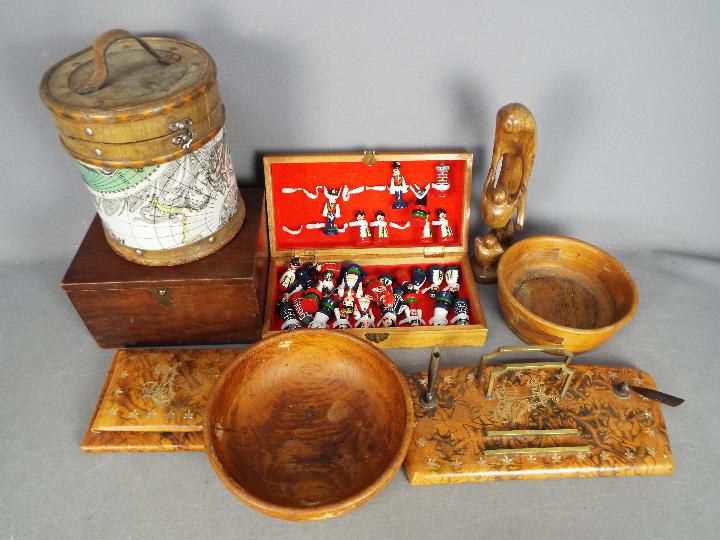 A collection of treen, wooden boxes, faux leather desk tidy,