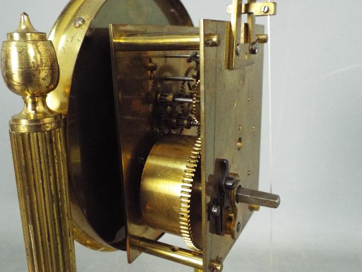 An early 20th century 400-day torsion clock, large 11cm enamel dial, mounted between reeded pillars, - Image 6 of 7