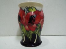 Moorcroft - a Moorcroft "Yeats" poppy vase issued in a limited edition 23/56, red, black,