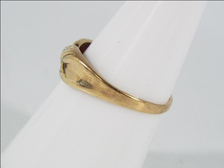 A 9ct gold and diamond set ring, size O, approximately 1.7 grams all in. - Image 2 of 5