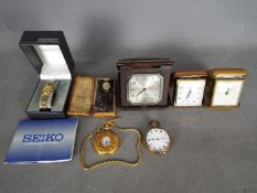 A collection of travel clocks and watches.