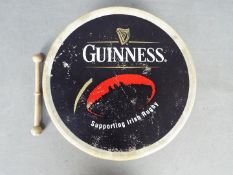 A vintage Guinness advertising bodhran,