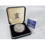 A 2001 Britannia Silver Proof £2 coin, encapsulated in presentation case with certificate.