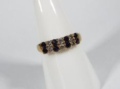 A 9ct yellow gold, diamond and sapphire set ring, size O, approximately 2.3 grams all in.