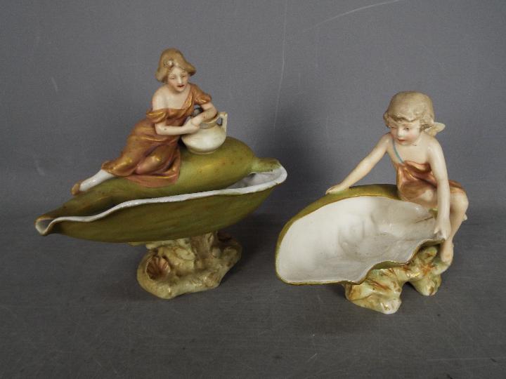 Royal Dux - Two figural shell centrepieces, largest approximately 19 cm (h).