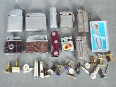 Mixed lot of collectables to include vintage lighters, vesta case, penknife, cufflinks and similar.