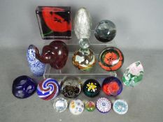 A collection of paperweights to include Caithness, Selkirk Glass, Strathearn, Mdina,