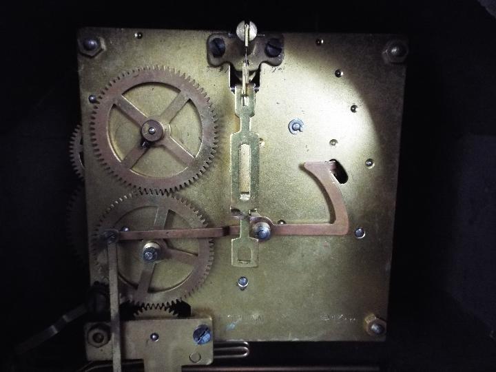 A mantel clock, Arabic numerals to a silvered chapter ring, with key and pendulum. - Image 5 of 6