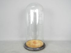 A large glass dome and base, approximately 51 cm (h).