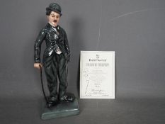 Royal Doulton - A limited edition figurine depicting Charlie Chaplin # HN2771,