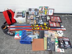 A pair of K2 skis, Salomon ski boots (size 8½), a quantity of DVD's,