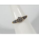 An 18ct gold illusion set diamond ring, size L½, approximately 2.