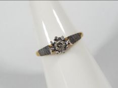 An 18ct gold illusion set diamond ring, size L½, approximately 2.