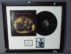 The Beatles - Framed autograph montage comprising a photograph,