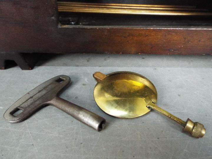A mantel clock, Arabic numerals to a silvered chapter ring, with key and pendulum. - Image 6 of 6
