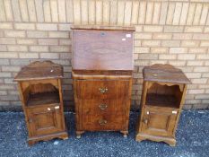 A small fall front bureau 106 cm x 53 cm x 40 cm and two bedside cabinets 74 cm x 38 cm x 26 cm.