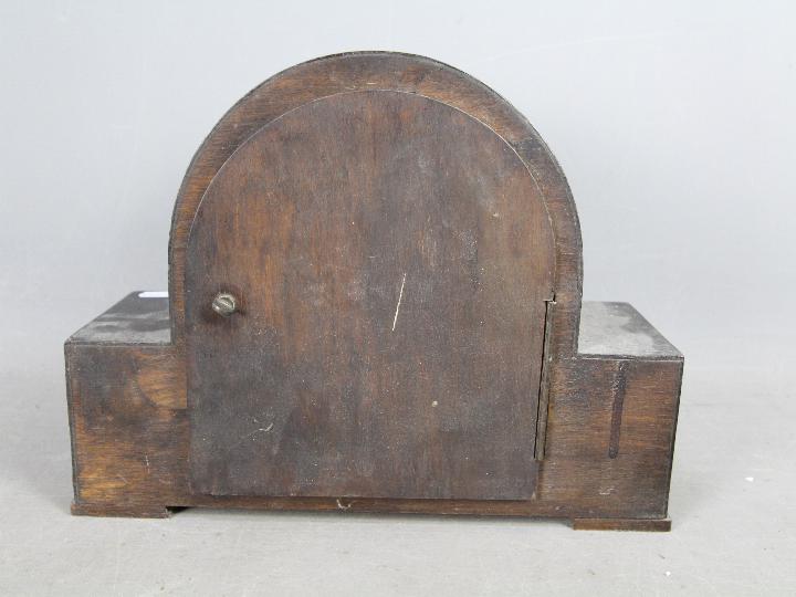 An oak cased mantel clock, Arabic numerals to the dial, with key and pendulum. - Image 6 of 6