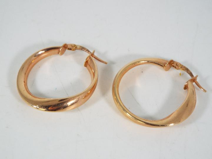 A pair of 9ct rose gold, Italian hoop earrings, approximately 2 grams all in. - Image 3 of 3