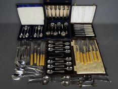 A collection of plated flatware with cased sets.
