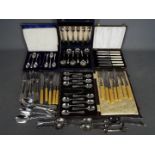 A collection of plated flatware with cased sets.