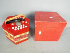 A boxed Scholer concertina.