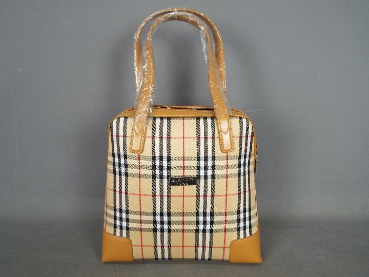 A Burberry Nova Check day bag.