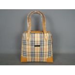 A Burberry Nova Check day bag.