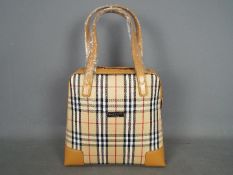 A Burberry Nova Check day bag.