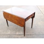 A drop leaf occasional table with frieze drawer, approximately 68 cm x 91 cm x 56 (106) cm.