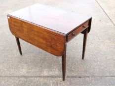 A drop leaf occasional table with frieze drawer, approximately 68 cm x 91 cm x 56 (106) cm.