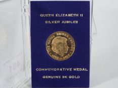 Queen Elizabeth II Silver Jubilee 9ct gold commemorative medal, approximately 2.6 grams all in.