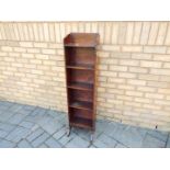 A small freestanding bookcase measuring approximately 118 cm x 31 cm x 24 cm.