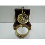 Saltney London - Compass (Brass). Fitted wooden box with brass inlay, anchor design on top.