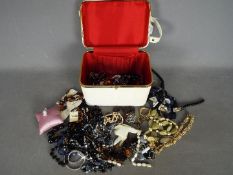 A quantity of costume jewellery to include necklaces, brooches, rings, bracelets and similar.