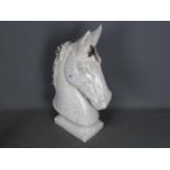 A large ceramic model of a horse's head,