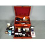 A jewellery box containing a collection of costume jewellery and similar,