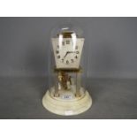 A rare Art Deco 400-day torsion clock in pale champagne finish,