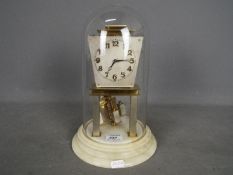 A rare Art Deco 400-day torsion clock in pale champagne finish,