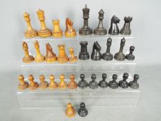 A complete chess set, pieces with weighted bases,