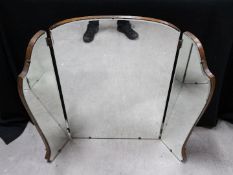 A triptych dressing table mirror with bevelled glass, approximately 82 cm x 97 cm when fully open.