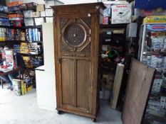 A good quality single wardrobe with carved detailing, approximately 196 cm x 85 cm x 39 cm.