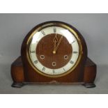 An oak cased mantel clock with Smiths movement, retailed by Kemp Brother, Bristol,