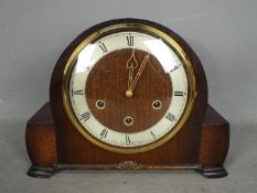 An oak cased mantel clock with Smiths movement, retailed by Kemp Brother, Bristol,