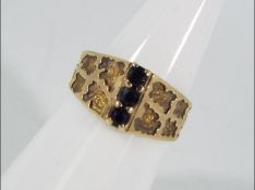 A 9ct yellow gold and sapphire ring, size N, approximately 3.