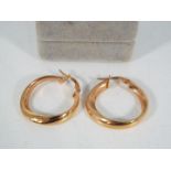 A pair of 9ct rose gold, Italian hoop earrings, approximately 2 grams all in.