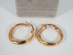 A pair of 9ct rose gold, Italian hoop earrings, approximately 2 grams all in.