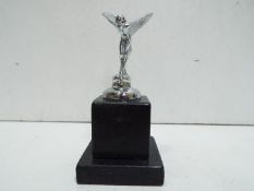 Chrome Flying Lady on Black marble plinth. 13cm high.