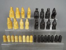 A 'Lewis Chessmen' chess set, 8.5 cm king.