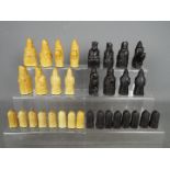 A 'Lewis Chessmen' chess set, 8.5 cm king.